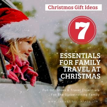 image of child in car with text overlay Christmas Gift Ideas: 7 Esentials for family travel at Christmas.
