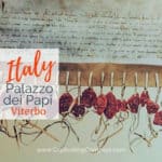 image of medieval papal papers with wax seals with text overlay Italy: Palazzo deiPapi - Viterbo by www.CaptivatingCompass.com