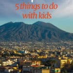 Panoramic view of Naples Italy and Mt. Visuvius with text overlay 'Naples: 5 things to do with kids.
