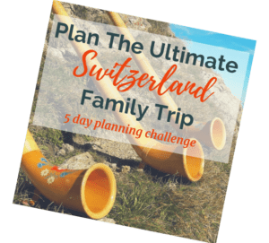 Image of Swiss Folk instrument (horn) on mountains overlooking lakes in summertime with text overlay "Plan your ultimate Switzerland trip. 5 day challenge