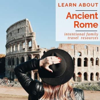 image of person holding black hat while looking up at the Colosseum in Rome, Italy