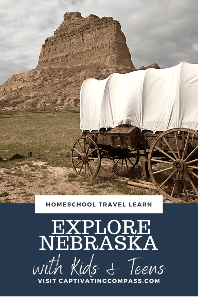 image of covered wagon tourist attractions of places to visit in Nebraska from CaptivatingCompass.com